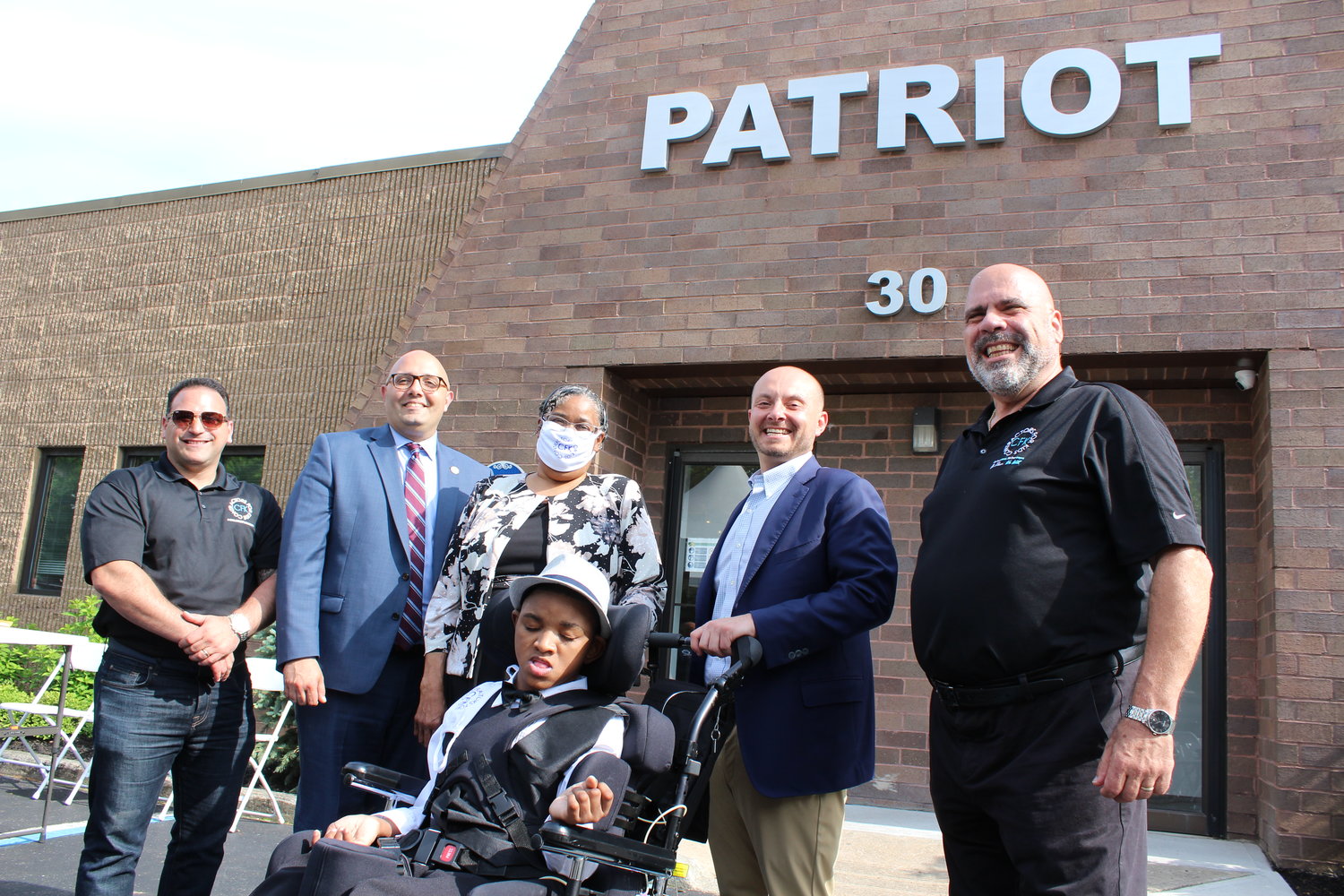 Contractors for Kids held their first Kevin Harney Courage Award. Left to right: Board president Steven DeLuca; award recipient Valerie Jackson with son Brian; board members Eric Seigneuray and Patricia Snedecor. Snedecor, from Patchogue, received a Courage Award.